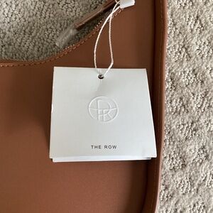 The Row Half moon bag in camel brown